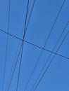 electricity cable over a blue sky Royalty Free Stock Photo