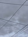electricity cable over a cloudy sky Royalty Free Stock Photo
