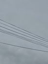 electricity cable over a cloudy sky Royalty Free Stock Photo