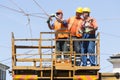 Electricity cpnstruction workers on a platform Royalty Free Stock Photo