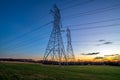 Electricity Distribution Towers and Wires at Dusk