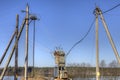 Electricity distribution transformer, electrical power substation in the countryside spring.