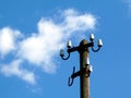 Electricity distribution wooden post with no cables under blue sky Royalty Free Stock Photo