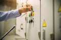 Technician checking air handling unit AHU starter button control panel of heating and air Royalty Free Stock Photo