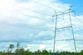 electricity lines on blue sky background. high-voltage power lines on transmission tower, energy voltage and sun shining Royalty Free Stock Photo