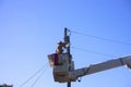 Power and electricity worker preparing to change street light