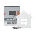 Electricity meter, house model and coins on white background Royalty Free Stock Photo