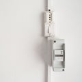 Electricity meter in a white wall Royalty Free Stock Photo