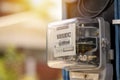 Electricity meters for home electrical appliances, including blurred natural green backgrounds. Royalty Free Stock Photo