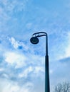 Electricity pole street light under blue sky. Royalty Free Stock Photo