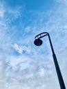 Electricity pole street light under blue sky. Royalty Free Stock Photo