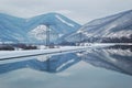 Electricity poles by water Royalty Free Stock Photo