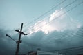 Electricity post and cloudy sky. Low angle view Royalty Free Stock Photo