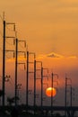 Electricity post in front of sunset background Royalty Free Stock Photo