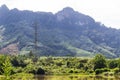 Electricity post beside the lake and mountain