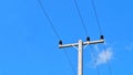 Electricity post and line cable on blue sky background Royalty Free Stock Photo