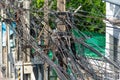 Electricity post with many wires and cables in wound various wires twisted in a skein Royalty Free Stock Photo