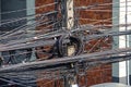 Electricity post with many wires and cables in wound various wires twisted in a skein Royalty Free Stock Photo