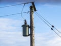 Electricity Power Lines and Transformer mounted on a pole Royalty Free Stock Photo
