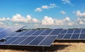 electricity power in nature. clean energy concept. solar panel with turbine and blue sky background