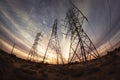 Electricity power pylons at sunset Royalty Free Stock Photo