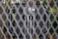 An electricity Power station with a danger sign the focus is through the fence surrounding it Royalty Free Stock Photo