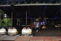 Electricity powered bumper cars or dodgems toy car for thai family people and children kid playing amusement carnival park in at