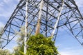 Electricity pylon - cloudy sky - low angle view Royalty Free Stock Photo