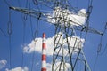 Electricity pylon and factory pipe Royalty Free Stock Photo