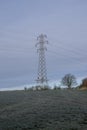 Electricity pylon in a field