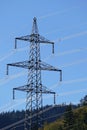 Electricity pylon, high-voltage power against blue sky Royalty Free Stock Photo