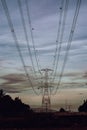 An electricity pylon is known as an overhead line pylon. high-voltage power lines at sunset. Royalty Free Stock Photo