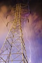Electricity Pylon with Lightning in Background. Royalty Free Stock Photo