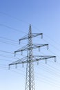 Electricity pylon power pole high voltage against blue sky Royalty Free Stock Photo