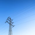Electricity pylon power pole high voltage against blue sky Royalty Free Stock Photo
