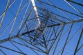 Electricity pylon shooted from below against the blue sky. Royalty Free Stock Photo