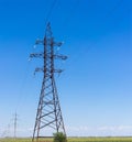 Electricity pylon silhouette against blue sky background. High voltage tower Royalty Free Stock Photo