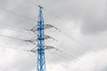 Electricity pylon silhouetted against cloud sky background. High voltage tower Royalty Free Stock Photo