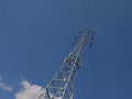 Electricity pylon and wires on a blue sky Royalty Free Stock Photo