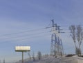 Electricity Pylon standard overhead power line transmission tower on the sky background Royalty Free Stock Photo