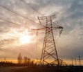Electricity Pylon - standard overhead power line transmission tower at sunset. Royalty Free Stock Photo