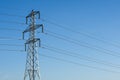 Electricity pylon tower with cables over blue sky landscape Royalty Free Stock Photo