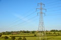 Electricity pylon tower with cables over blue sky landscape Royalty Free Stock Photo