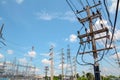 Electricity pylon,Electricity tower station with cloudy and sun over blue sky Royalty Free Stock Photo