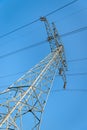 Electricity pylon with wires against a blue sky Royalty Free Stock Photo