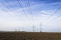 Electricity pylons with distribution power station blue cloudy sky background Royalty Free Stock Photo