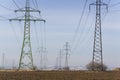 Electricity pylons with distribution power station blue cloudy sky background Royalty Free Stock Photo