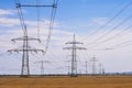 Electricity pylons line up one after the other Royalty Free Stock Photo