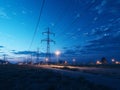 electricity pylons at night in a rural area