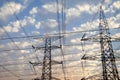 Electricity pylons and power lines, at sunset Royalty Free Stock Photo